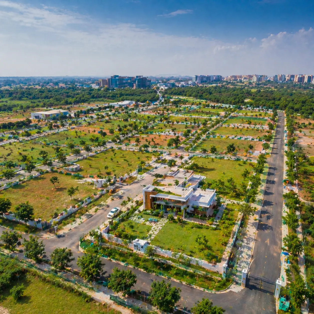 Serene green farmland landscape near sarjapur, with open fields, rural roads, and peaceful countryside surroundings