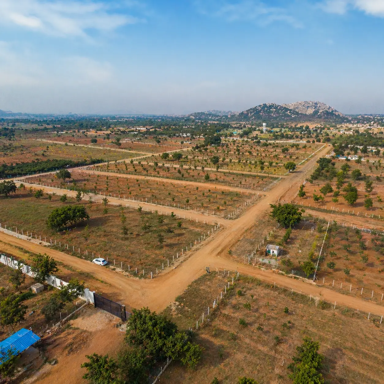 Anekal near bangalore, a serene green landscape with farmland, roads, and rural surroundings.