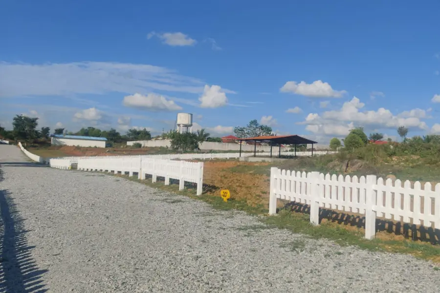 Internal gravel road with boundary fencing at Lakeview Farms