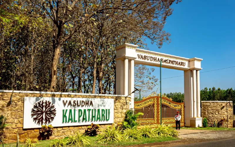 Main entrance arch of Vasudha Kalpataru Farms managed farmland community